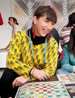Megan Cope with young visitors at the Gallery, creating art using maps / Photograph: Ray Fulton